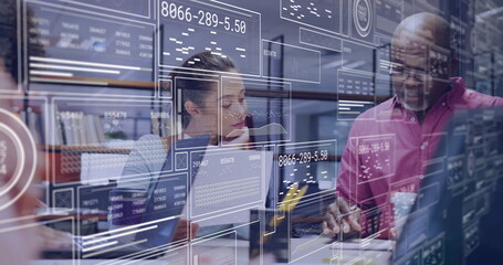 Fototapeta premium Business meeting with data analytics image over diverse colleagues in office