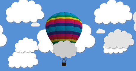 Fototapeta premium Hot air balloon with rainbow stripes floating among clouds image