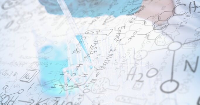 Chemical formulas and equations image over scientist using pipette in laboratory - Powered by Adobe