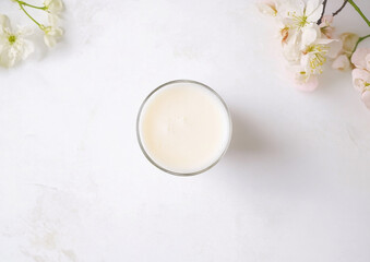 A clear glass filled with fresh milk, isolated on a white background. Perfect for dairy product branding, nutrition concepts, and food advertisements.