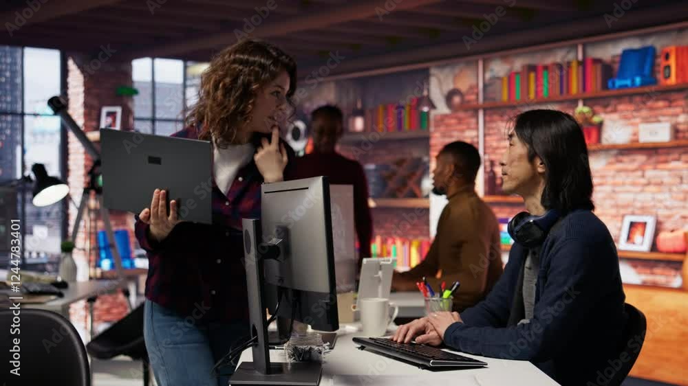 Poster startup intern holding laptop asks questions to senior technician coding advanced ai algorithm. empl