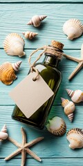 A green bottle with a blank tag surrounded by seashells and a starfish on a wooden surface.