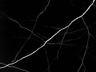 Black marble texture background displays elegant white veins naturally occurring.