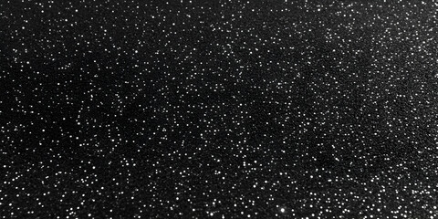 Obraz premium Black Glittery Background Sparkles with Tiny White Dots Scattered Evenly Across the Surface.
