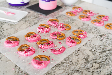 Homemade Gourmet: Delightful Pretzels Adorned with Pink Chocolate and Sprinkles