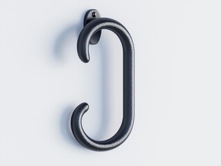 Fototapeta premium A close-up view of a sleek black metal hook mounted on a clean white wall for modern home decor and organization. Isolated on white background