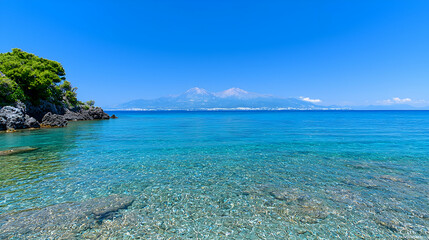 Fototapeta premium Clear turquoise sea, coastal view, mountain backdrop, summer holiday