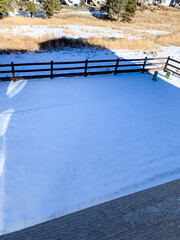 Fresh snow covering backyard on sunny morning