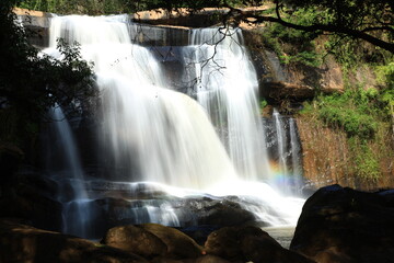 Fototapeta premium Tat Hueang Waterfall or Namtok Tat Hueang (Namtok Thai-Lao) the most beautiful of Phu Suan Sai, become the murder line between Thai-Laos. Phu Suan Sai National Park, Loei province THAILAND