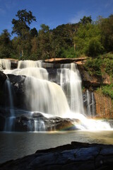 Obraz premium Tat Hueang Waterfall or Namtok Tat Hueang (Namtok Thai-Lao) the most beautiful of Phu Suan Sai, become the murder line between Thai-Laos. Phu Suan Sai National Park, Loei province THAILAND