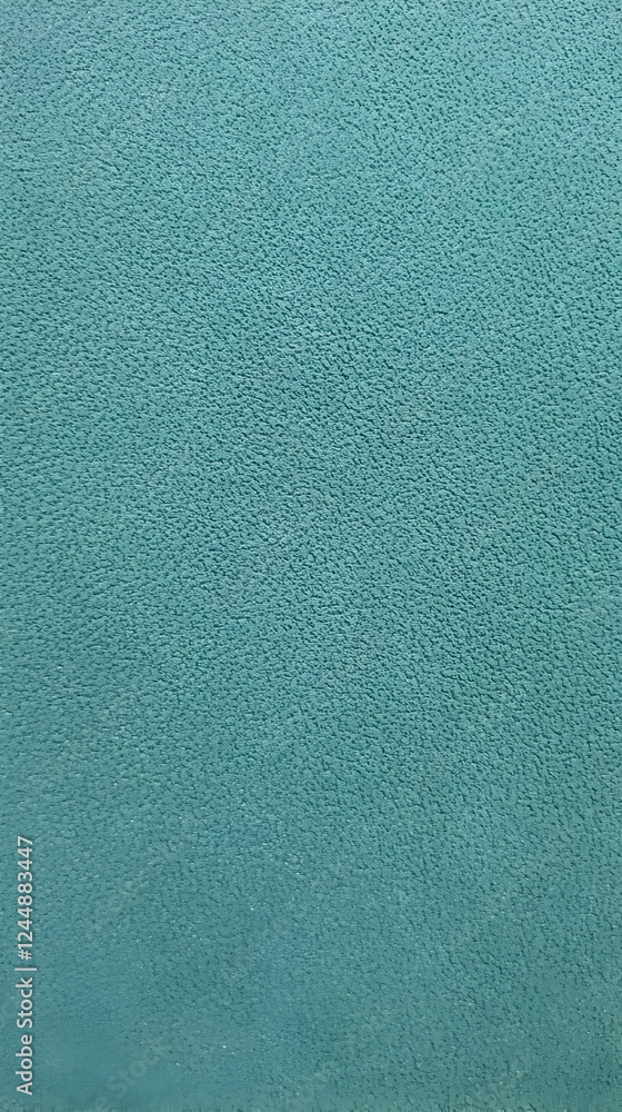 Poster close-up of textured teal surface displays a subtle pattern with uniformly sized bumps.