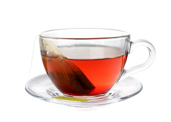 Cup with teabag isolated on white. Brewing aromatic tea