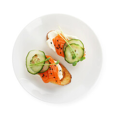 Delicious bruschette with cream cheese, salmon and cucumber isolated on white, top view