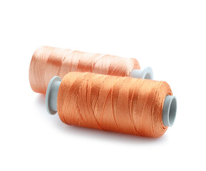 Spools of bright sewing threads isolated on white