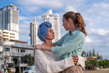 Moment friend support, resilience, and compassion, often associated with of battling cancer wearing...