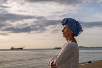 Woman wearing a headscarf, a common symbol of strength among cancer patients undergoing treatment...