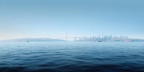 Panoramic View of the Bosphorus Bridge, Spanning Across the Blue Sea with Istanbul's Skyline in the Background and Boats Sailing Underneath.