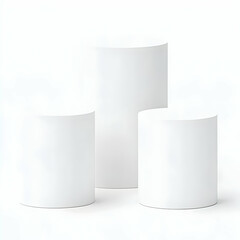 Three White Cylindrical Podiums Stand on a White Surface for Product Display