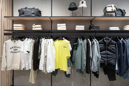 Bangkok, Thailand - October 17, 2024: various apparel displayed inside the Armani Exchange store at Satellite Terminal 1 (SAT-1) in Bangkok's Suvarnabhumi Airport.
