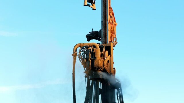 Machinery operates efficiently, drilling deep into the earth to access valuable natural resources.  