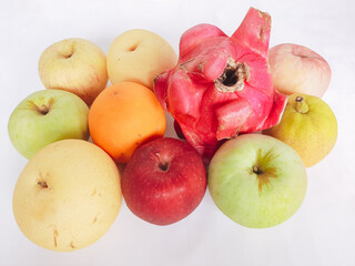 Assorted tropical fruits on white background
