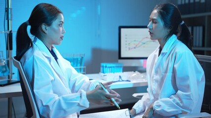 Two scientists collaborating in a modern laboratory setting