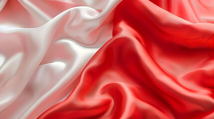 Obraz premium Elegant draped red and white satin fabric showcasing smooth textures and gentle folds