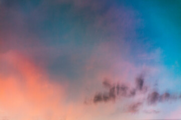 A long exposure photo of the dawn sky through a moving car's window