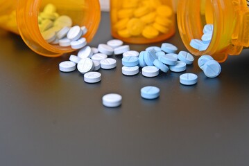 pills spread out of pill bottles