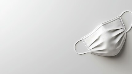 Simple white mask on a neutral background.