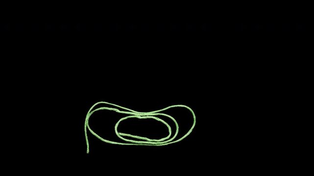 Green thread creates a pattern. A stop-motion video made using real thread. It is editable as it is in alpha format.

