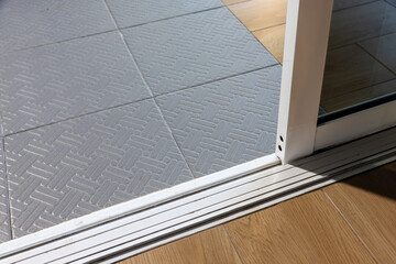 Dust on sliding door sills and bottom tracks ,  these areas need cleaning.