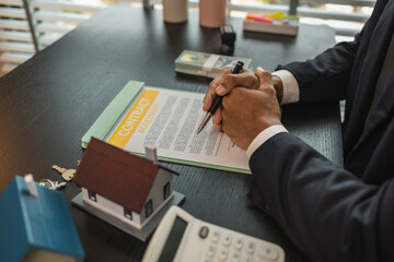 a real estate agent is explaining the details of a home purchase contract to a buyer, he is telling them that is is a worthwhile investment, property, estate, mortgage