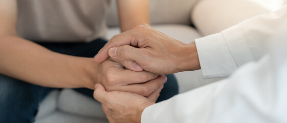psychiatrist hold hand support each while discussing family issues. doctor encourages and empathy woman suffers depression. psychological, save divorce, Hand in hand together, trust, care
