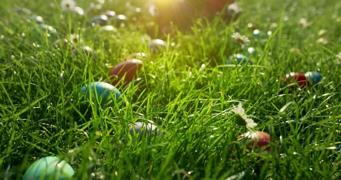 Easter eggs in basket in grass. Colorful decorated easter eggs in wicker basket.