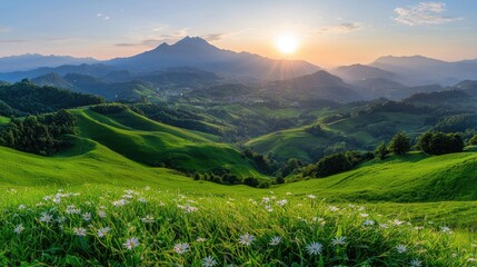 Naklejka premium Sunset over rolling green hills and village