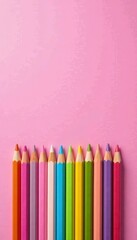 Fototapeta premium Pastel rainbow colored pencils on bright pink paper texture background, pink, colors, art supplies
