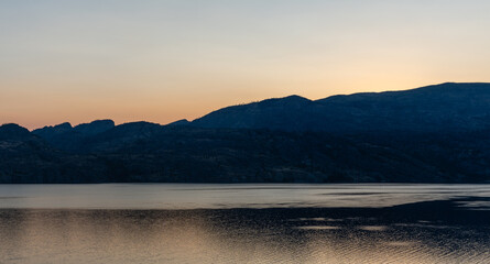 beautiful sunrise scene over a tranquil Okanagan lake British Columbia Canada