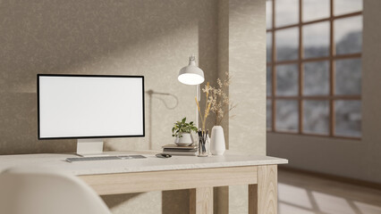 A computer and decorative items on a desk, set against a wall in a minimalist room.