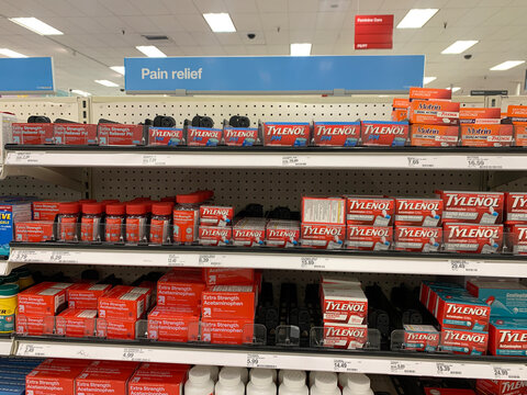 A retail store pharmacy shelf displays Tylenol and Acetaminophen products under a Pain Relief sign, organized by type and size, with clear price labels - California, USA - January 29, 2025