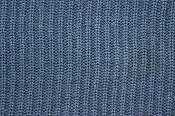 Knitting pattern Knitted seamless background in blue. Knit textures for wallpapers and backgrounds.