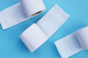 Toilet paper on blue background.