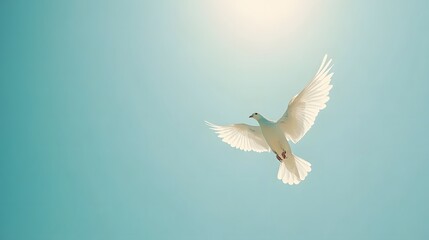 Obraz premium White dove soaring upwards against clear blue sky, symbolizing freedom, peace, and hope, with minimalistic and serene composition