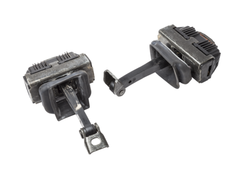 Metal and plastic car spare parts on a white isolated background - door stopper that prevents hard touches of body elements, damage or breakage. Detail of a mechanical assembly.