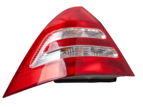 A taillight of a stop signal for a German auto - optical equipment of white and red color on a white isolated background. A spare part for repair and sale in a car service center.