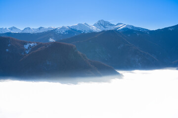Mountain landscape with fog and snow in the morning. 