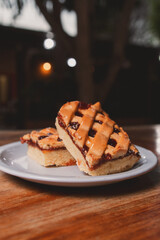 Pasta frola on a plate on a wooden table.