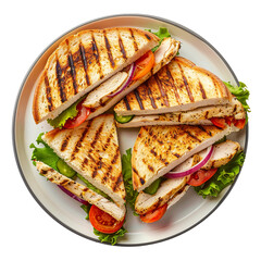 Grilled chicken sandwiches with lettuce, tomato, and avocado slices on a ceramic plate, top view.