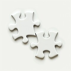 Obraz premium Two white puzzle pieces isolated on white background, symbolizing connection or completion.