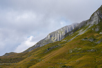 Fototapeta premium Grass covered stone mountains of Durmitor National Park